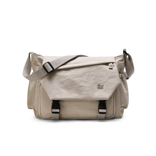 Beige shoulder bag with a visible brand logo on a white background
